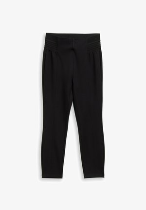 Black trousers with a wide textured waistband, tapered legs, and pleated detailing running vertically along the sides. Smooth fabric finish.