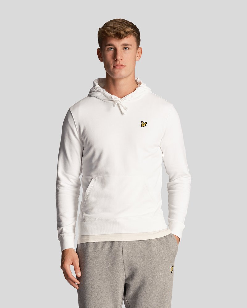 Sweat à capuche blanc avec cordon de serrage, poche kangourou, poignets et taille côtelés. Équipe d'un petit logo jaune sur la poitrine.