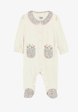 Peto de bebé color crema con cuello floral rosa y verde, bolsillos florales a juego con flores bordadas y cubrepies florales, botones de presión en la parte delantera.