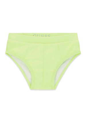 Jasnozielone męskie kąpielówki typu slipy z szerokim pasem i widocznym przeszyciem z przodu, z marką GUESS wewnątrz pasa.