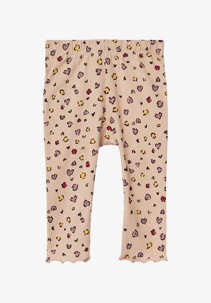 Leggings beige clair avec un ourlet en forme de vagues, présentant un motif ludique de cœurs et de taches dans des teintes de rose, jaune et noir. Matériau doux.