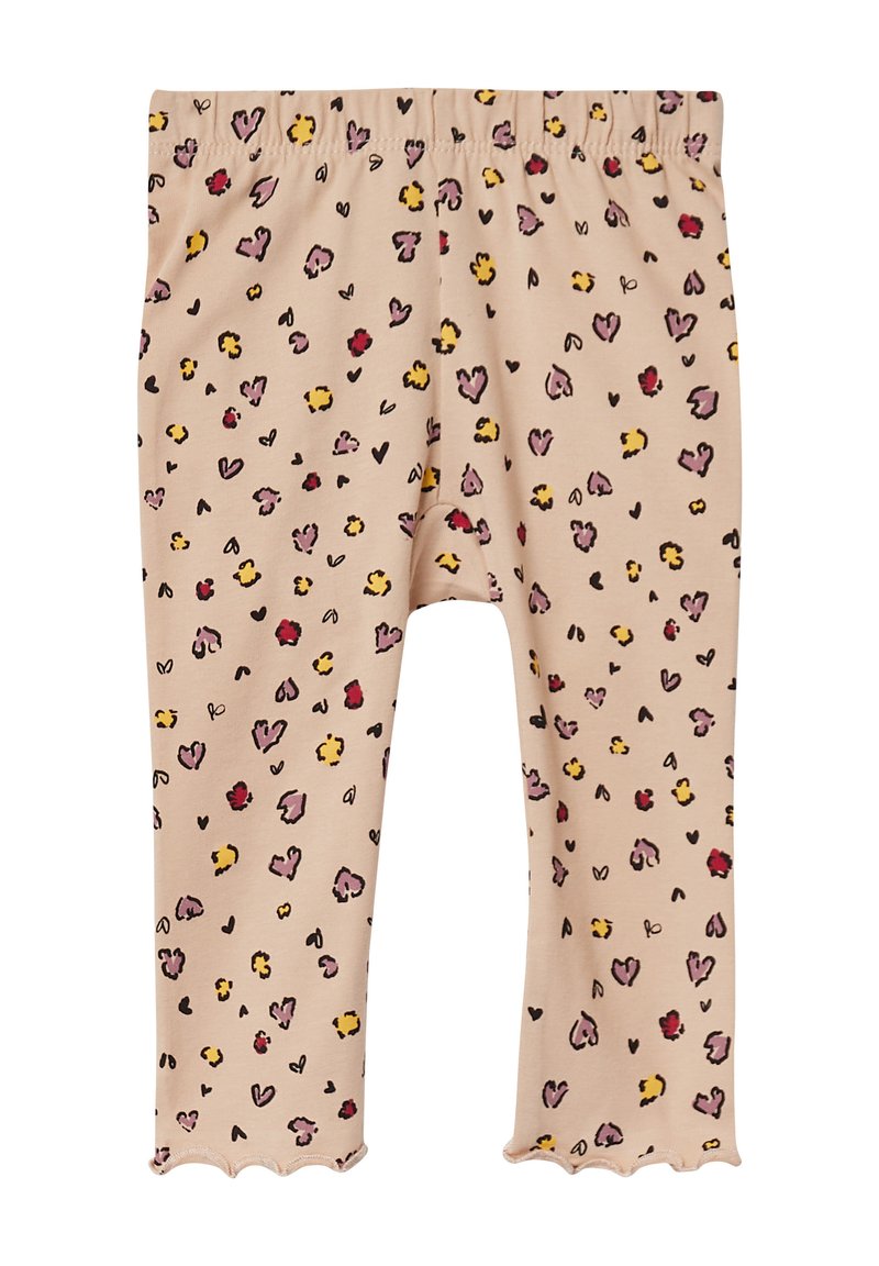 Lichtbeige leggings met een golvende zoom, met een speels patroon van harten en stippen in tinten van roze, geel en zwart. Zacht materiaal.