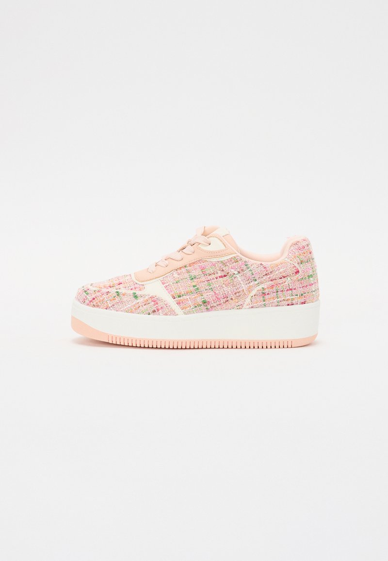 Pink tweed sneakers with a textured upper, white sole, and pink accents. Features lace-up design and thick platform for added height.