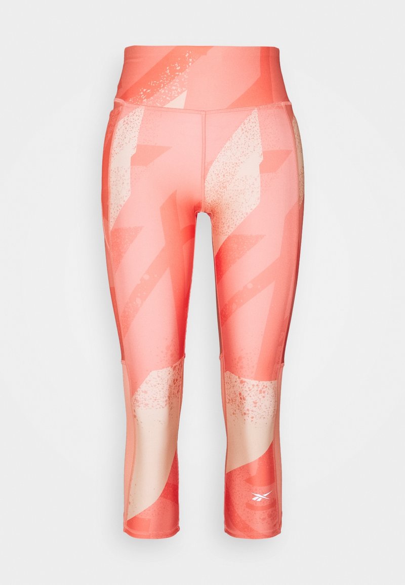 Capri leggings in a coral hue featuring a geometric pattern, high waistband, and smooth, stretchy fabric for comfort and mobility.