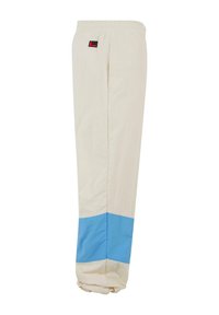 Pantaloni ușori, bej, cu un panou inferior albastru. Prezintă o talie elastică și un mic logo pe lateral. Textură netedă.