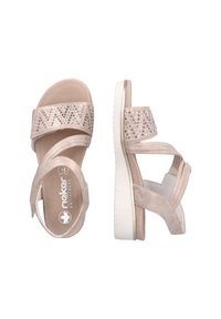 Light pink sandal with suede straps, decorative rhinestones, and a white rubber sole. Features adjustable straps for a secure fit.