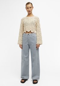 Object BESTICKTES - Trui - sandshell