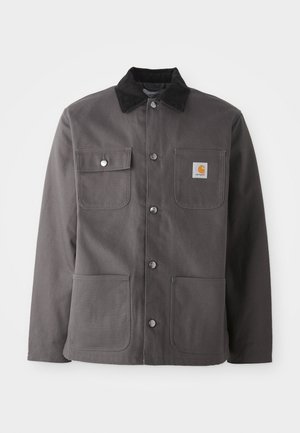 Dark gray work jacket with a corduroy collar, two front pockets, snap buttons, and a patch logo on the left chest.