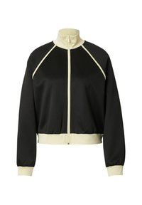 Zwarte zip-up jas met hoge kraag, crèmekleurige accenten op de raglanmouwen en de zoom. Glad materiaal met rib gebreide manchetten, cropped design.
