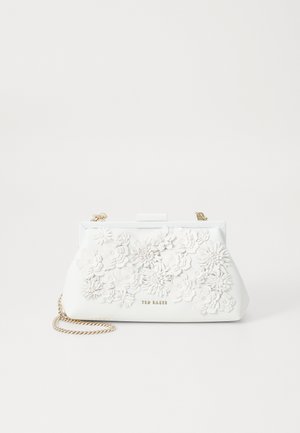 White leather clutch bag with a floral applique design. Features a gold chain strap and a clasp closure. Textured surface with intricate flowers.