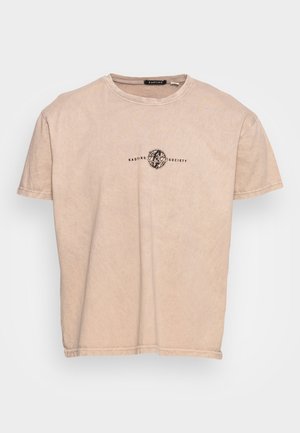 Beige short-sleeve T-shirt with round neck and small black "Kaotiko Society" logo and abstract globe design centered on the chest.