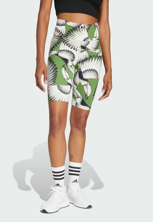 Hoog gewaisted fietsbroekjes van groen stof met zwart-wit toekanveerprint. Glad materiaal, getailleerd ontwerp, lengte tot halverwege de bovenbenen.