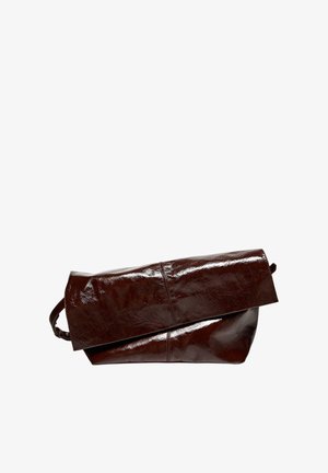 Dark brown glossy leather fold-over clutch bag with a sleek, minimalist design and a hidden strap on white background.