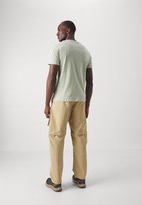 The North Face ANCOHUMA LOOSE PANT - Szabadtéri nadrágok - khaki stone