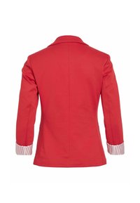 Blazer rouge à manches longues avec des poignets blancs présentant de fines rayures rouges, vu de dos sur un fond blanc uni.