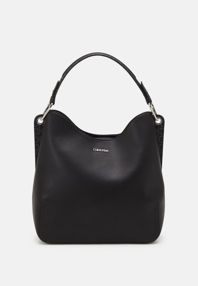 Black leather handbag with a smooth texture and a soft, curved shape. Features a top handle and a subtle logo detail on the front.