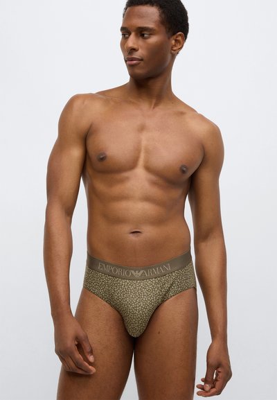 Zielone majtki z wzorem, z elastycznym paskiem w pasie z logo „Emporio Armani”. Gładka faktura, dopasowany krój i minimalistyczny design zapewniający niewielkie pokrycie.