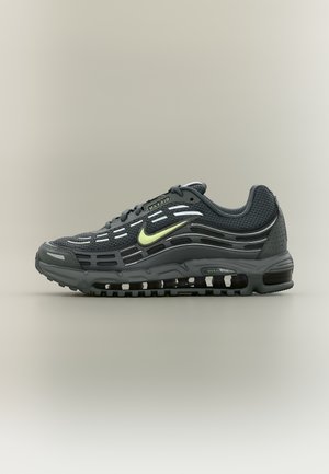 Dunkelgrauer Nike Air Max Herrensneaker mit Mesh-Obermaterial, sichtbarer Luftdämpfung in der Sohle und hellgrünem Nike-Swoosh an der Seite.