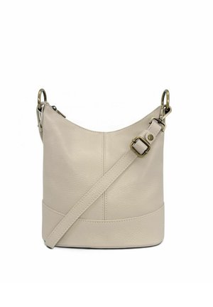 Sac seau en cuir beige avec bandoulière réglable et ferrures en laiton, présenté sur fond blanc.