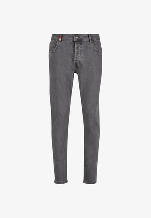 Harmaan farkkutakit, joissa on kapea malli, klassinen viisi taskua -design, metallinen painonappisuljenta ja hienovarainen haalistuminen kankaassa.