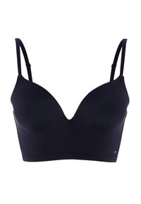 Reggiseno nero con design senza cuciture, tessuto leggero, scollatura a V profonda, spalline regolabili e logo discreto nella parte inferiore sinistra.