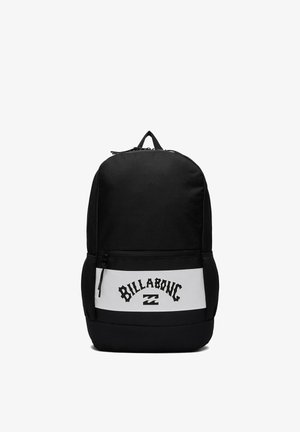 Black backpack with a front white panel featuring the word "Billabong" and a wave logo, side mesh pockets, and a top zipper.