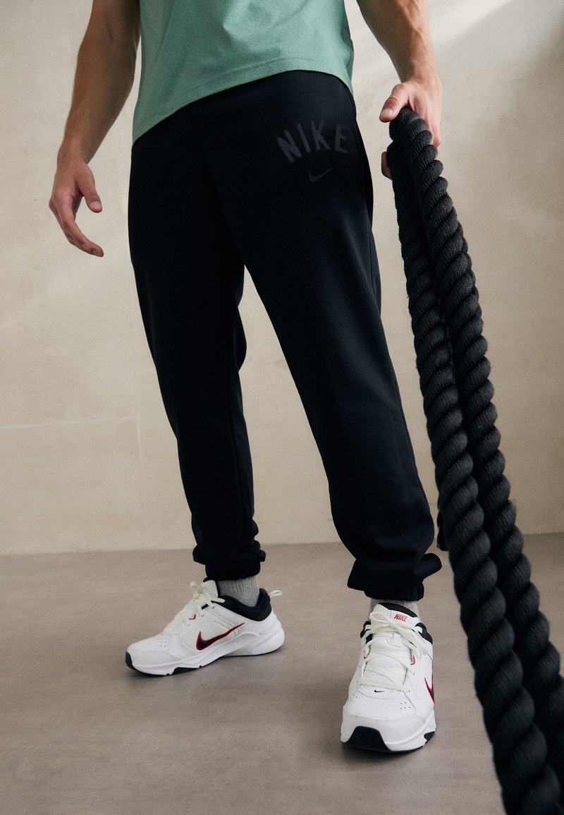 Nike Performance JOGGER - Tepláky - black/white
