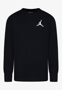 Svart långärmad t-shirt i bomull, med rund hals och en vit Jumpman-logga på vänster bröst. Mjuk textur, standard passform.