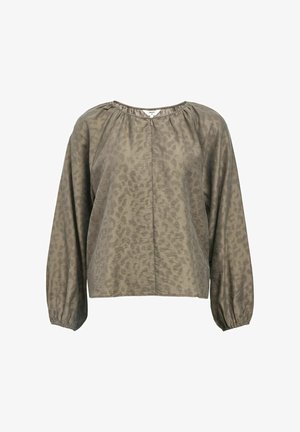 Blouse en imprimé léopard kaki avec de longues manches bouffantes, un col rond et une fermeture éclair centrale. Tissu léger et lisse avec une texture subtile.