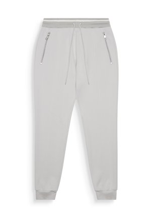 Joggers gris claro hechos de una tela suave y elástica con un corte ajustado. Cuentan con una cintura con cordón, dos bolsillos laterales con cremallera y puños acanalados.