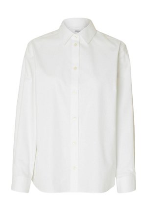 Bijela bluza dugih rukava od pamuka, s klasičnim ovratnikom, prednjim kopčanjem na dugmad i ležernim krojem s blago zaobljenim rubom.