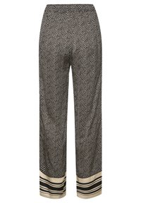 Zwart-witte broek met visgraatpatroon, voorzien van een elastische tailleband en een crèmekleurige zoom met zwarte strepen.