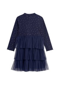 Granatowa sukienka z długimi rękawami, prążkowany top z złotymi kropkami oraz warstwowa spódnica z tiulu składająca się z trzech warstw. Ząbkowane krawędzie rękawów.