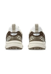 Brown and cream athletic shoes with a textured outsole, mesh panels, and reflective accents. Features a pull tab on the heel for easy wear.