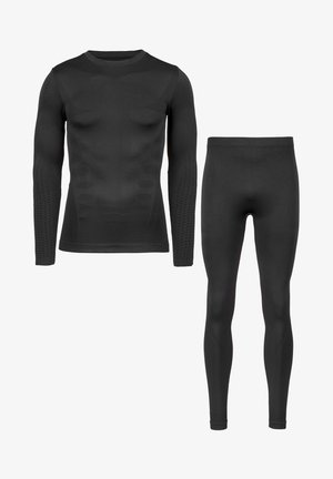 Langärmliges schwarzes Kompressionsshirt mit strukturierten Akzenten und passenden schlichten schwarzen Leggings, beide aus dehnbarem, glattem Material gefertigt.