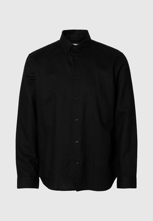 Chemise noire à manches longues avec col, boutons sur le devant et poignets standards, présentée sur un fond gris clair.