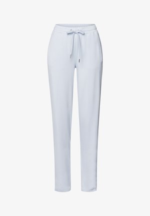Lyseblå træningsbukser med elastisk talje, justerbar snøre og tætsiddende ben. Glat stof uden synlige mønstre eller hardware.