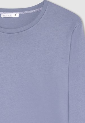 Maglietta a maniche lunghe di colore lilla, con colletto a girocollo e etichetta di taglia S di Terranova all'interno del colletto, mostrata su una superficie piana.