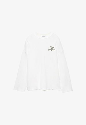 Weißes, langärmliges Rippshirt mit rundem Ausschnitt und dem in Schwarz gedruckten Text "EFFORT IN progress" auf der linken Brustseite.