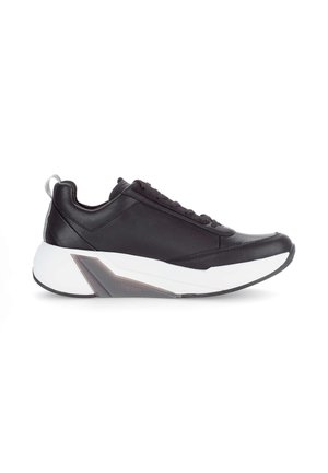Black low-top sneaker with sleek leather upper, white chunky sole, and "rollingsoft" cushioning detail on the side.