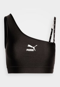 Reggiseno sportivo nero con una spallina, che presenta un logo Puma bianco. Tessuto liscio e elastico con un design elegante e dettagli a contrasto sulla spallina.