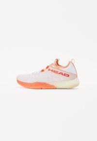 Sports shoe featuring a lightweight mesh upper in white and pastel peach, with orange accents, a textured sole, and a prominent brand logo.
