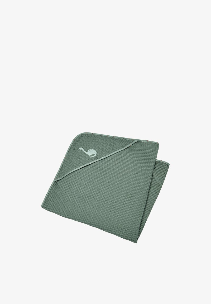 Green textured blanket with a folded corner, featuring a small white snail logo, and accent stitching along the edges.