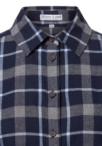 Navy and gray plaid shirt; cotton material, button-down collar, five brown buttons, alternating large and small squares in a soft texture.