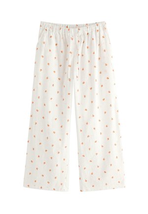 Pantaloni bianchi larghi con vita elasticizzata, caratterizzati da una stampa integrale di piccoli frutti arancioni e tasche laterali.