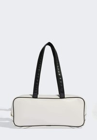 White rectangular bag with black leather straps, featuring a smooth texture and subtle piping along the edge. No visible hardware.