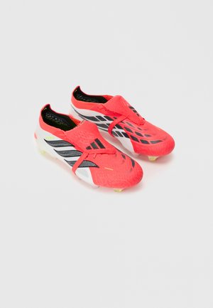 Pair of bright coral and white soccer cleats with black and neon yellow details, featuring a textured upper and lace cover on a white background.