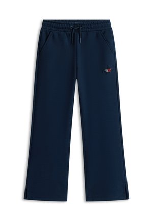 Pantalones deportivos azul marino con cintura elástica, cordón ajustable, bolsillos laterales, piernas rectas y un pequeño emblema de estrella en rojo, blanco y negro en el muslo derecho.