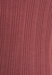 Knitted fabric in a deep burgundy color featuring vertical ribbed texture. Smooth and slightly glossy, reflecting light with fine details.