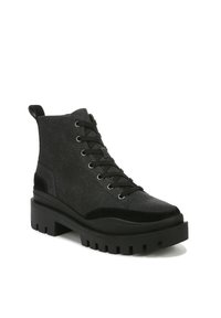 Black ankle boots with a combination of textured fabric and suede, featuring a chunky rubber sole, lace-up front, and reinforced heel tab.